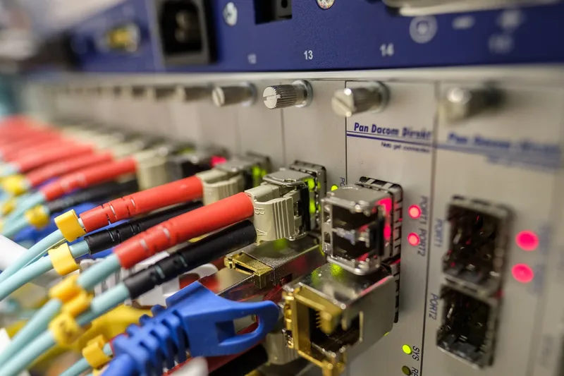 Network patch panel with fibre and ethernet cabling